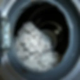 A close-up view of a clogged dryer vent with lint buildup