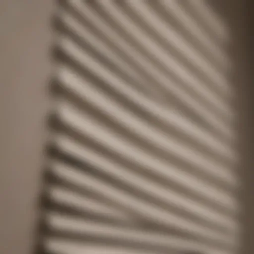 A close-up view of a pleated blind with dust accumulation