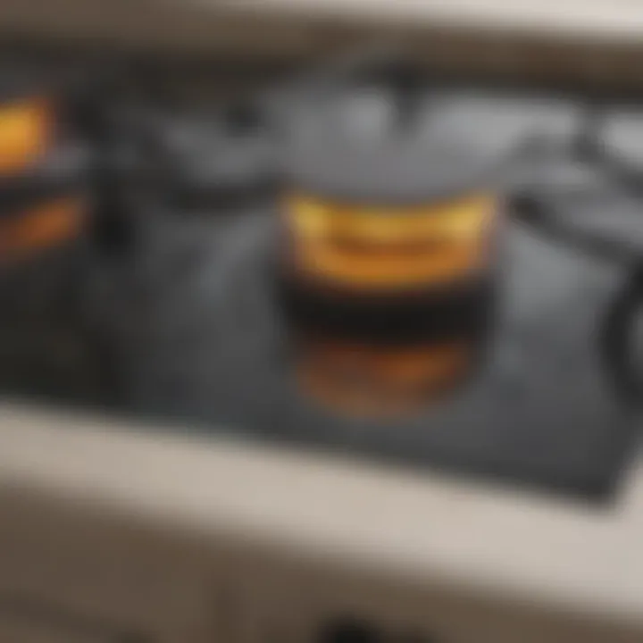 Close-up of a clean glass top stove reflecting light