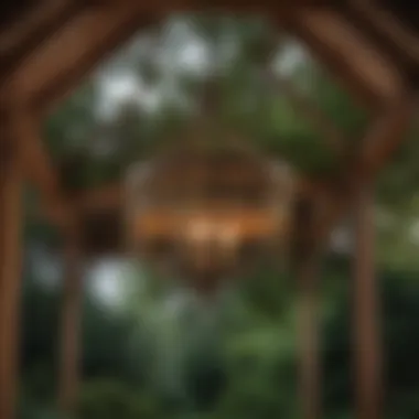 Rustic chandelier hanging in a wooden gazebo surrounded by greenery