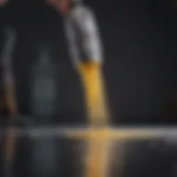 Close-up view of a paint sprayer in action, showcasing the fine mist of paint being applied to a surface.