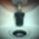 Detailed view of a sink drain with garbage disposal unit