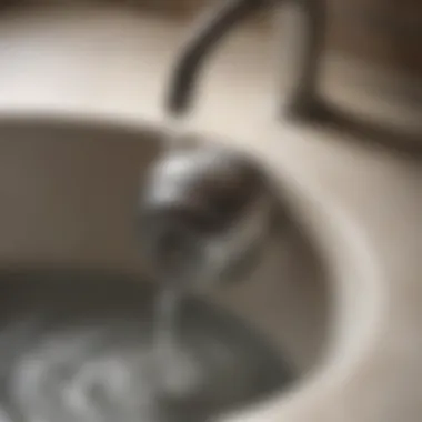 A close-up of a clogged sink drain with water buildup