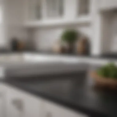 Close-up of black countertops beautifully contrasting with white cabinetry