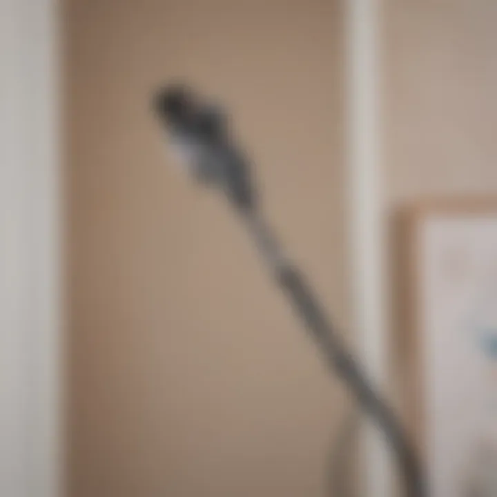 A user easily accessing their wall-mounted Shark cordless vacuum for quick cleaning.